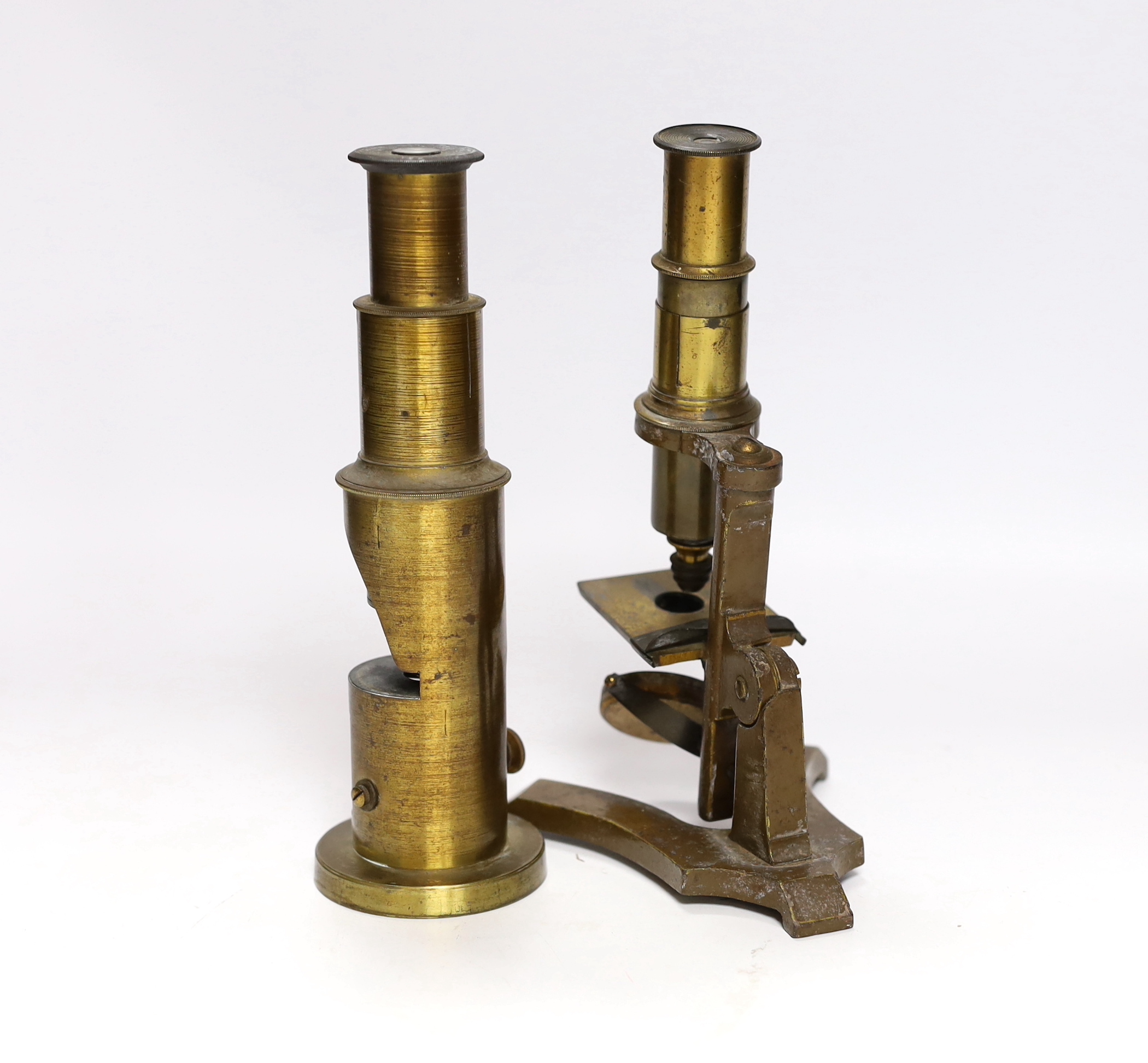 Two 19th century microscopes; a student’s field microscope together with another on a brass stand, 20cm